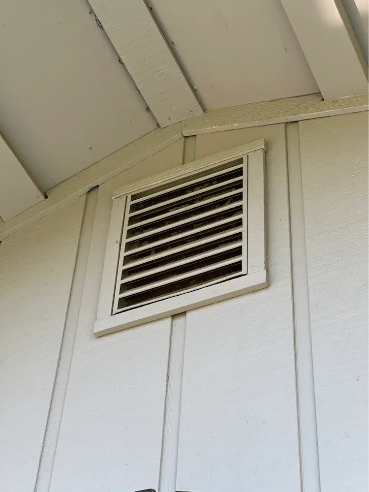 Gable vent with exterior downward angled baffles. These can be difficult to assess from the ground but magnification with a camera or bright flashlight illuminating it at a certain angle may assist with identification.