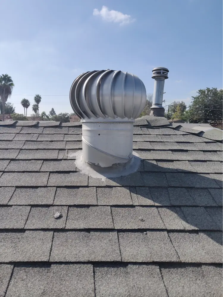 Whirlybird brand turbine vent installed on an asphalt composite shingle roof.  Mesh screening for these vents, when present, can only be assessed from the interior and the mesh screen size is typically greater than 1/8 inch mesh.
