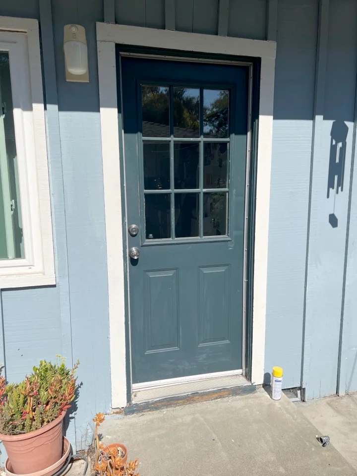 Fiberglass door with double pane tempered glass window. Note the lack of seams where the vertical stiles would join the horizontal rails if it were a wood door.