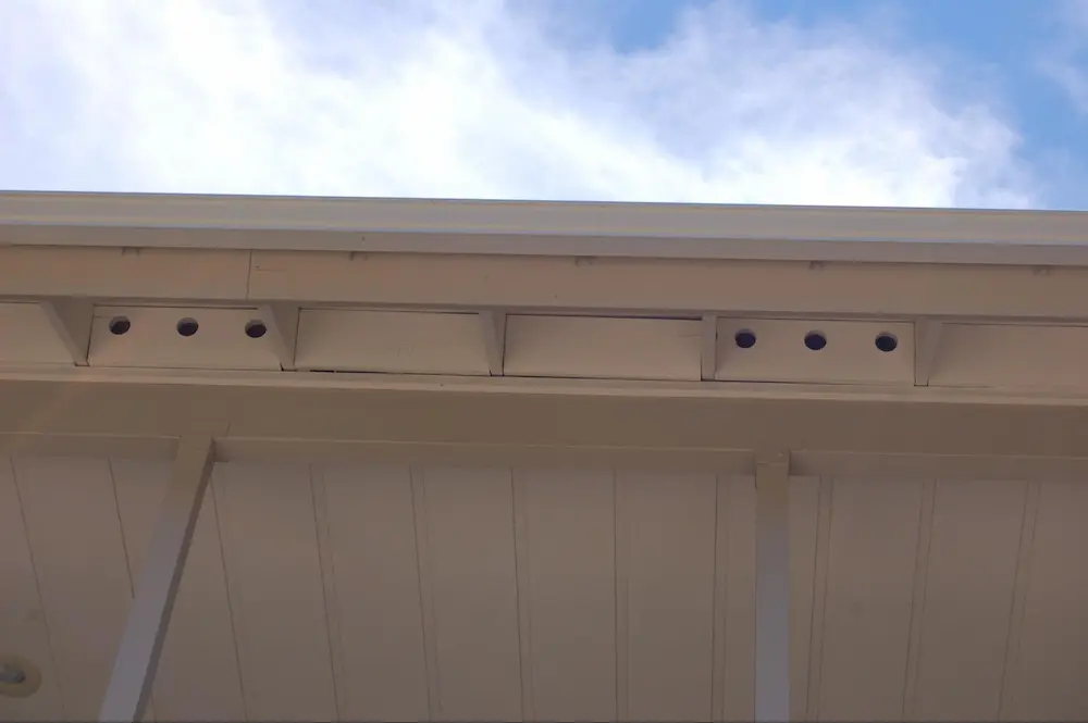 Note gaps between blocking and top chord, sheathing and rafters. Caulking these gaps will minimize the chance of embers accumulating in these gaps.