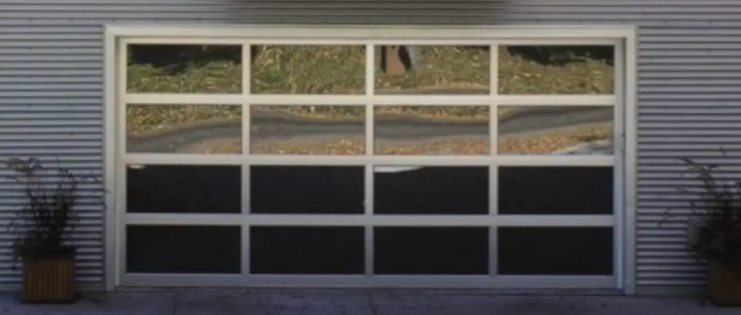 Aluminum metal noncombustible garage door. Note thin rails and stiles with transparent panels.