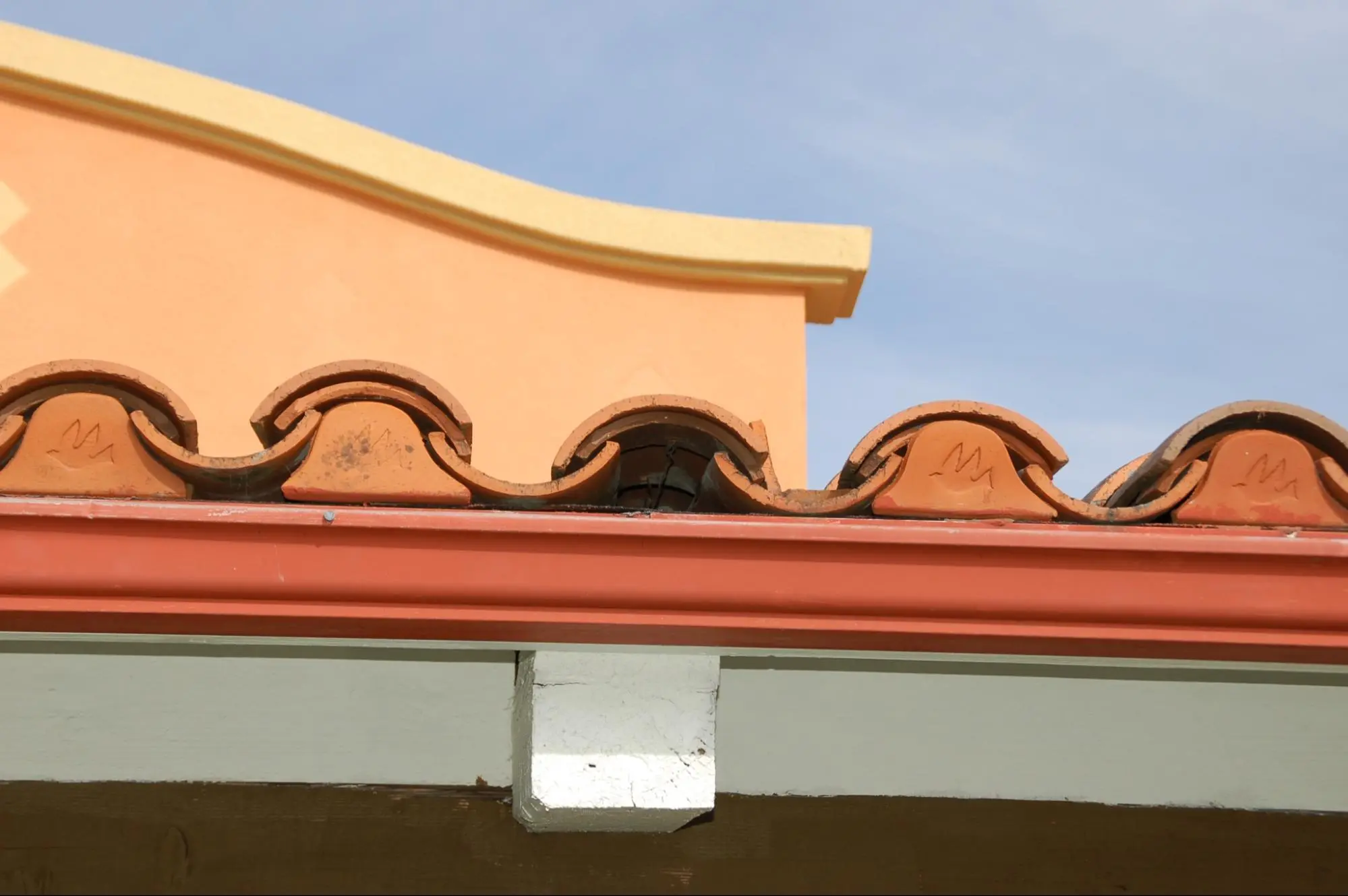 Commercial bird-stop product with one stop missing. Note gaps greater than 1/8" in size between stops and tiles, which creates a debris and ember ignition hazard.