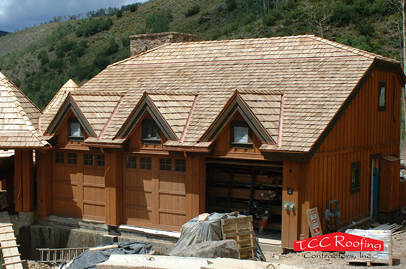 Wood roof covering that was likely pressure-impregnated with a fire retardant chemical that will decrease in effectiveness in a relatively short amount of time. All wood roofs should be replaced with a Class A fire-rated roof regardless of condition or age. Credit: TCC Roofing Contractors, Inc.
